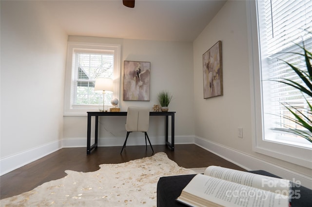 office space featuring dark wood-type flooring and baseboards