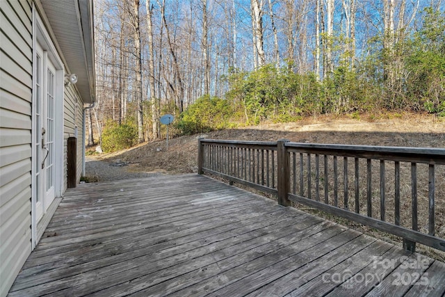 deck featuring a forest view