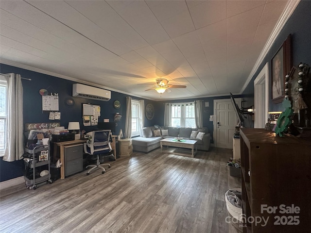 office area featuring ceiling fan, a wall unit AC, wood finished floors, and ornamental molding