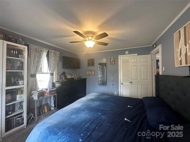 carpeted bedroom with a ceiling fan and crown molding