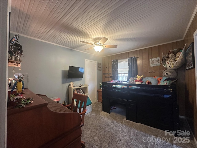 carpeted bedroom featuring ceiling fan, wooden walls, ornamental molding, and wooden ceiling