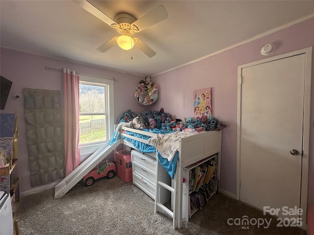 bedroom with a ceiling fan, carpet flooring, and crown molding