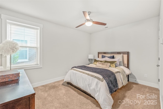 bedroom featuring carpet floors, baseboards, and visible vents