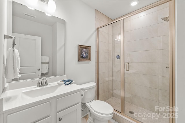 full bath with a stall shower, visible vents, and toilet