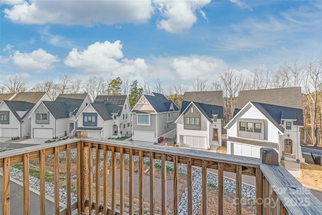 wooden deck featuring a residential view