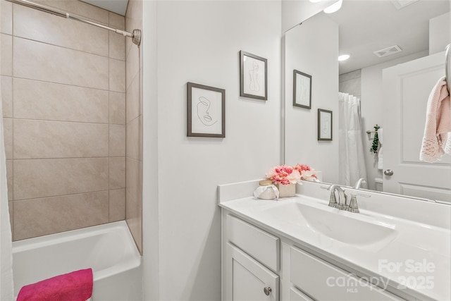 bathroom with vanity and visible vents