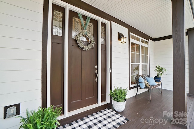 doorway to property featuring a porch