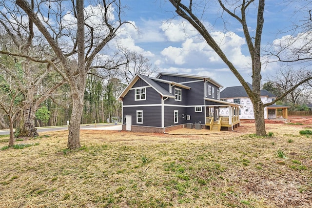 back of house with a wooden deck