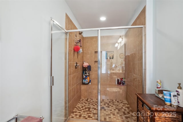 full bath with a shower stall