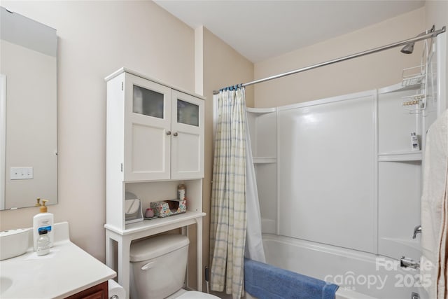 full bathroom with vanity, shower / bath combination with curtain, and toilet