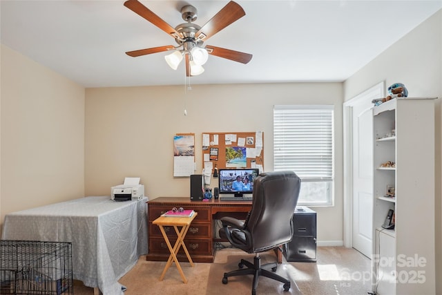 office with a ceiling fan, carpet flooring, and baseboards