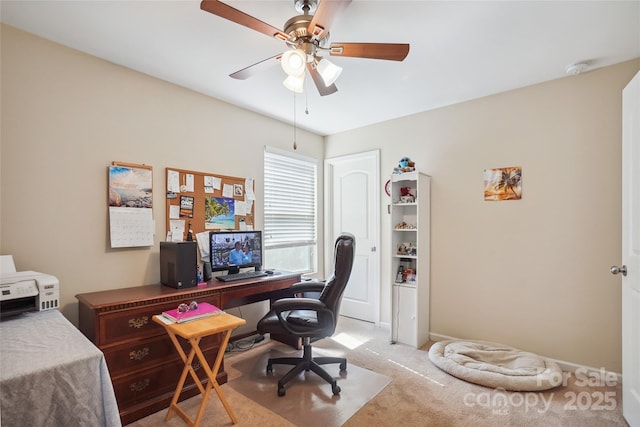 office space with light carpet and ceiling fan