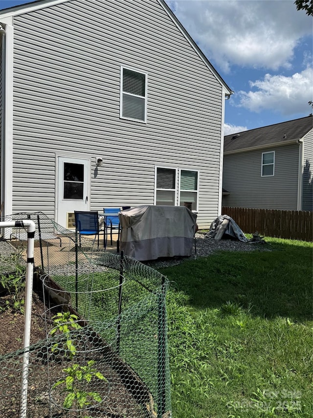 1021 Joselynn Dr, Gastonia, NC 28054 - back of property with a vegetable garden