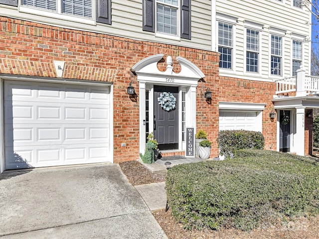 doorway to property with brick siding