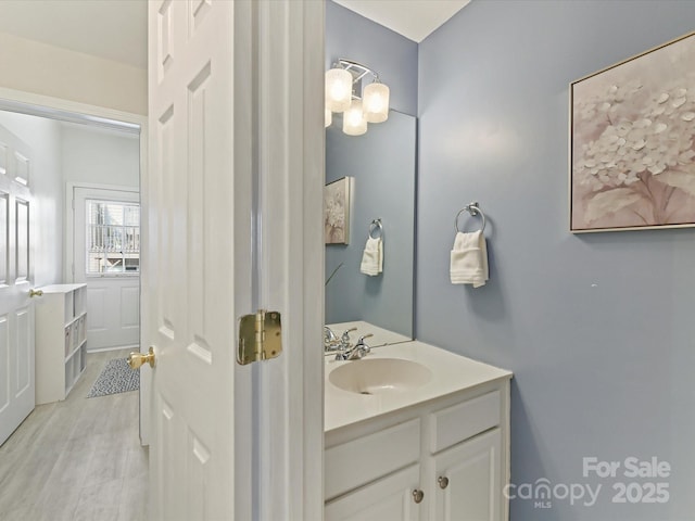 bathroom featuring vanity and wood finished floors