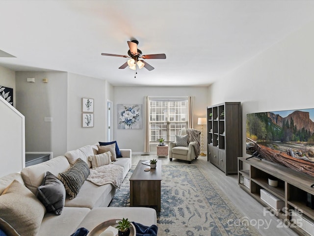 living area featuring ceiling fan and wood finished floors