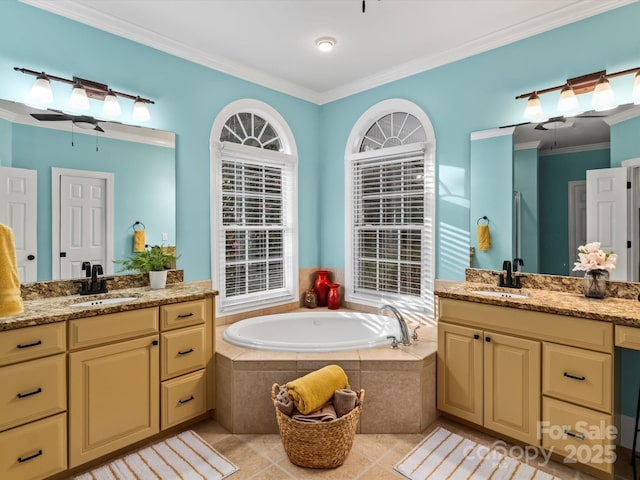 full bathroom with a garden tub, tile patterned flooring, two vanities, a sink, and ornamental molding