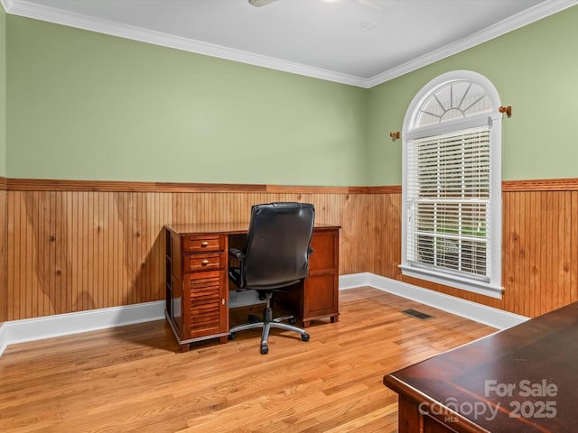 office with a wealth of natural light, wainscoting, and visible vents