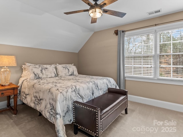 bedroom with carpet, visible vents, a ceiling fan, vaulted ceiling, and baseboards