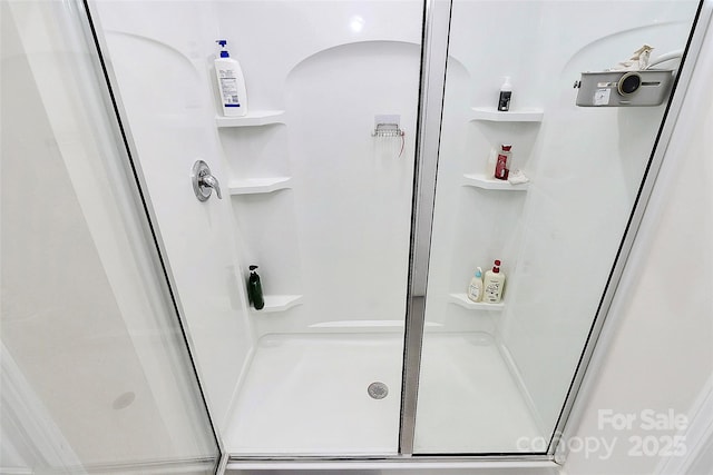 bathroom featuring a stall shower