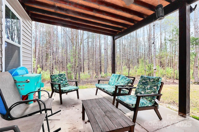 view of patio / terrace featuring a view of trees