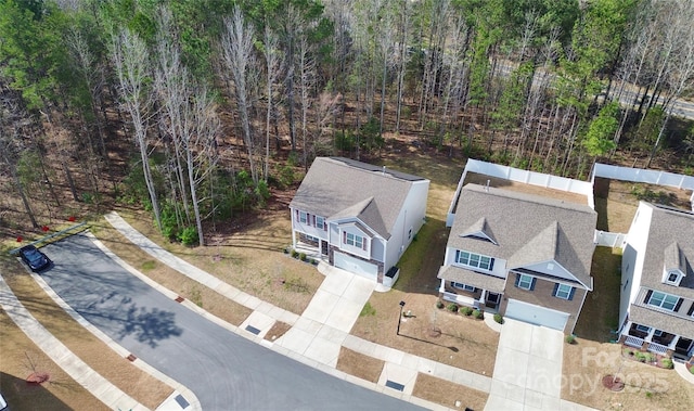 aerial view featuring a wooded view