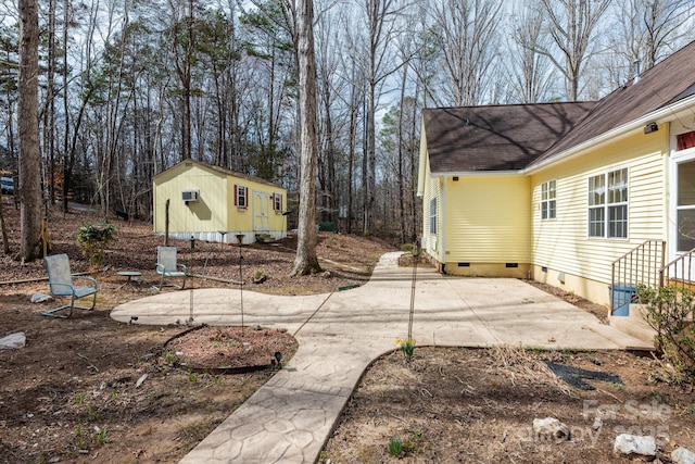 view of yard with a patio and an outdoor structure