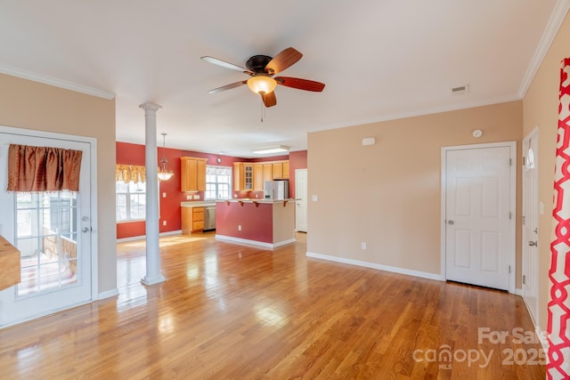 unfurnished living room featuring ceiling fan, light wood-style floors, baseboards, ornamental molding, and ornate columns