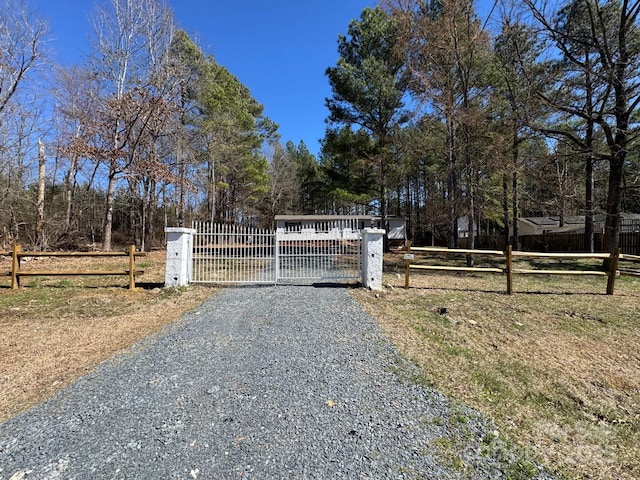 view of gate featuring a fenced front yard