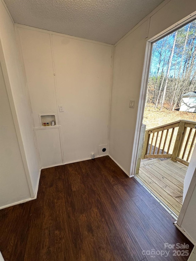 washroom featuring a textured ceiling, laundry area, washer hookup, wood finished floors, and electric dryer hookup