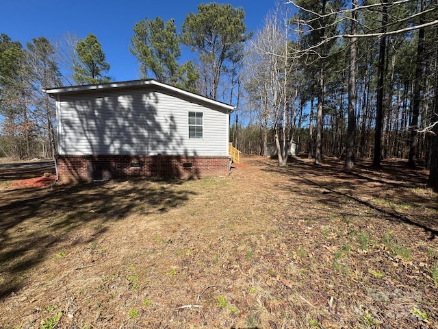 view of home's exterior with crawl space