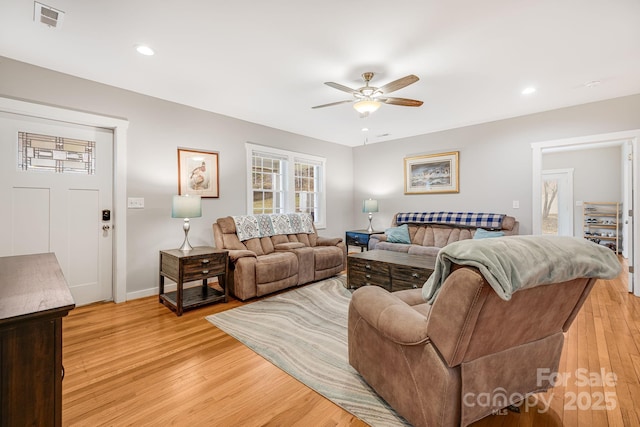 living room with light wood-style flooring, recessed lighting, visible vents, and a ceiling fan