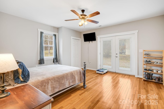 bedroom featuring ceiling fan, light wood-style flooring, baseboards, access to exterior, and french doors