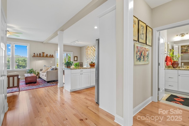 50 Rose Creek Rd, Leicester, NC 28748 - hall featuring a sink, baseboards, ornate columns, and light wood-style flooring