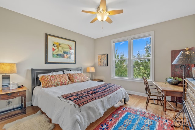 50 Rose Creek Rd, Leicester, NC 28748 - bedroom featuring baseboards, ceiling fan, and wood finished floors