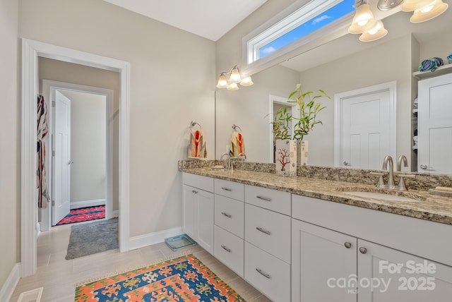 50 Rose Creek Rd, Leicester, NC 28748 - bathroom with a sink, baseboards, double vanity, and visible vents