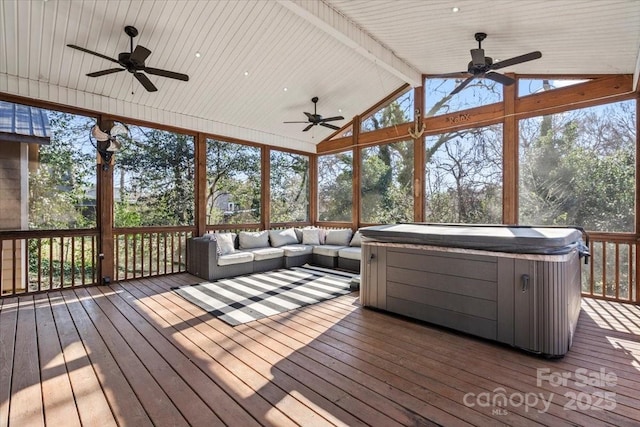 unfurnished sunroom with a jacuzzi and lofted ceiling with beams