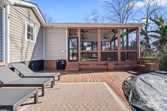 wooden deck with a sunroom