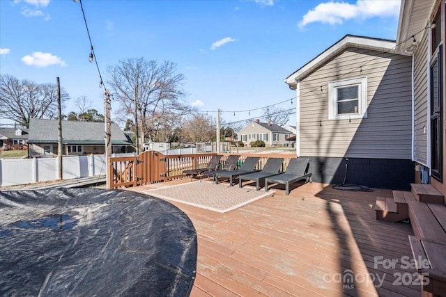 deck featuring a residential view and fence