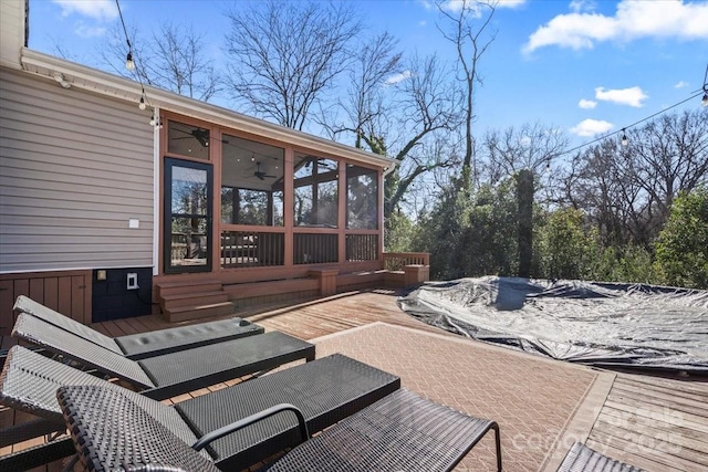 view of patio with a sunroom