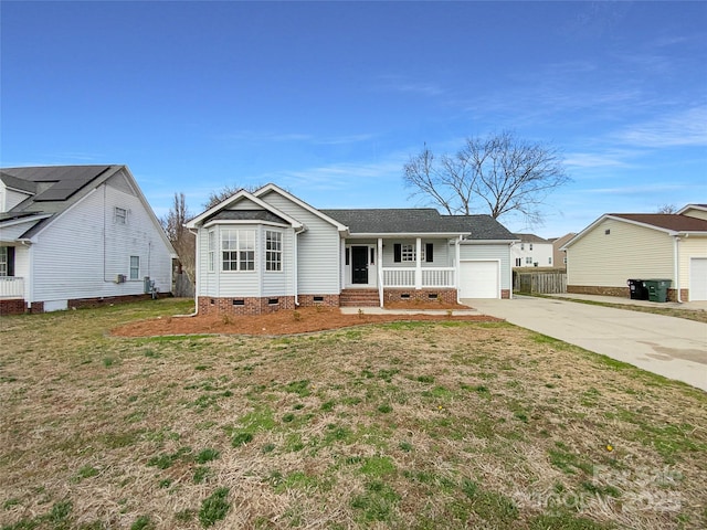 ranch-style home with covered porch, concrete driveway, crawl space, a garage, and a front lawn