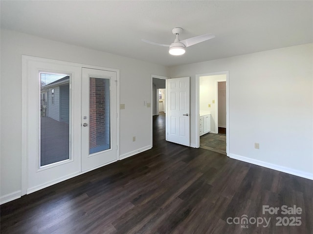 empty room with ceiling fan, baseboards, dark wood-type flooring, and french doors