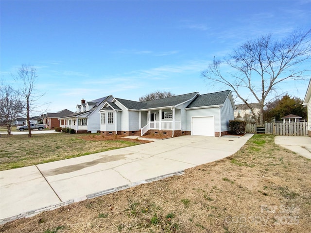 single story home with concrete driveway, crawl space, fence, a garage, and a front lawn