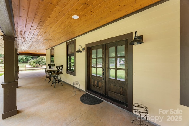 13124 Lemmond Dr, Matthews, NC 28105 - doorway to property featuring french doors and covered porch