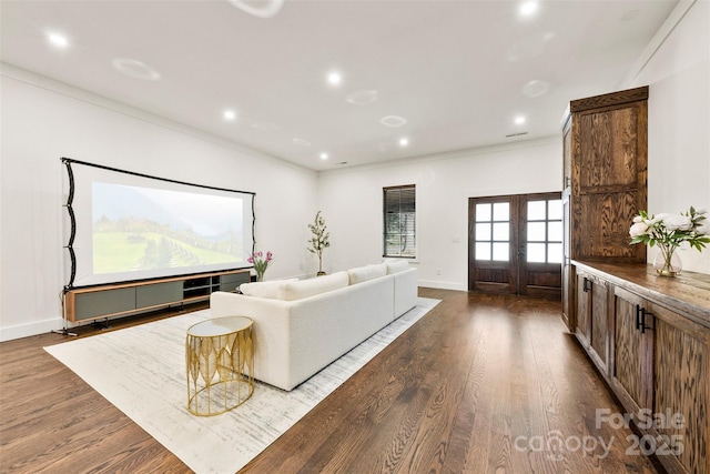 13124 Lemmond Dr, Matthews, NC 28105 - living area with french doors, dark wood-type flooring, crown molding, and recessed lighting