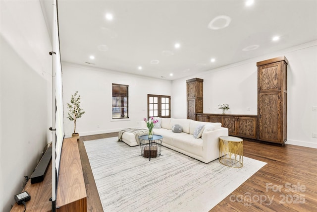 13124 Lemmond Dr, Matthews, NC 28105 - living area with wood finished floors, recessed lighting, and crown molding