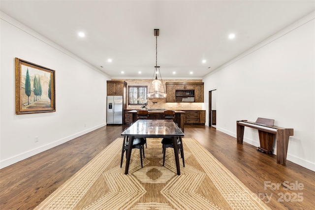 13124 Lemmond Dr, Matthews, NC 28105 - dining area with recessed lighting, dark wood-style flooring, and ornamental molding