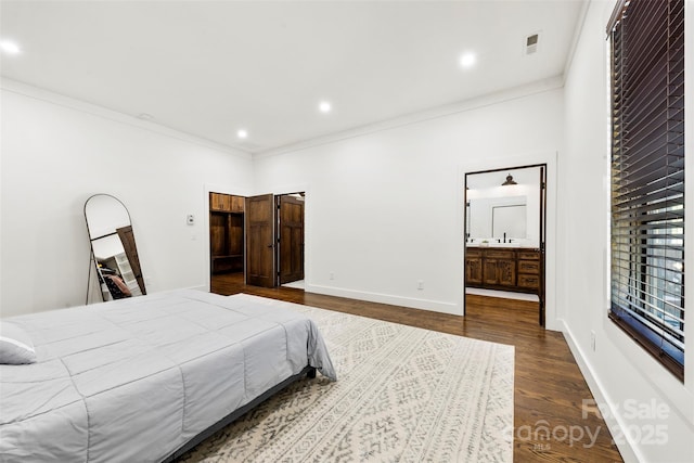 13124 Lemmond Dr, Matthews, NC 28105 - bedroom with crown molding, dark wood finished floors, recessed lighting, and connected bathroom