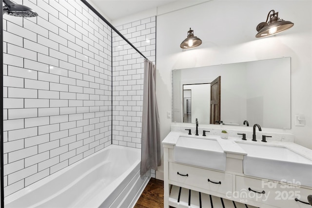 13124 Lemmond Dr, Matthews, NC 28105 - full bath featuring shower / bathtub combination with curtain, double vanity, and wood finished floors
