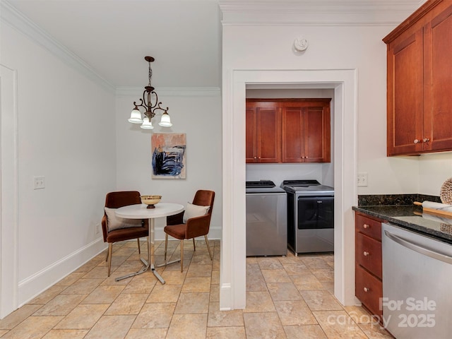 kitchen with washer and clothes dryer, dark stone counters, ornamental molding, pendant lighting, and stainless steel dishwasher